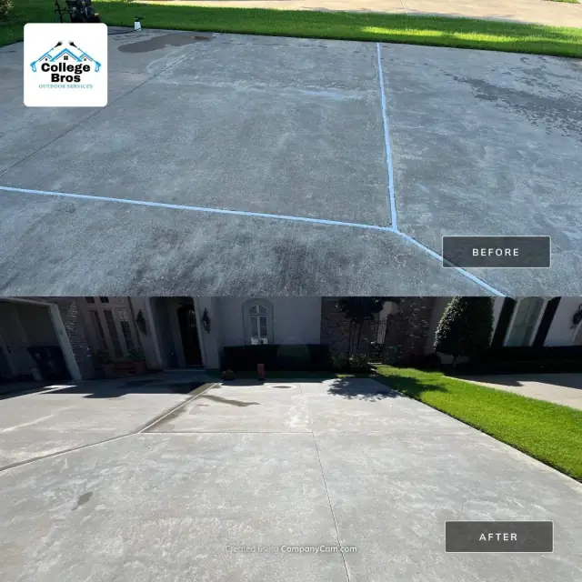 Large uniformly clean driveway fronting an upscale white home